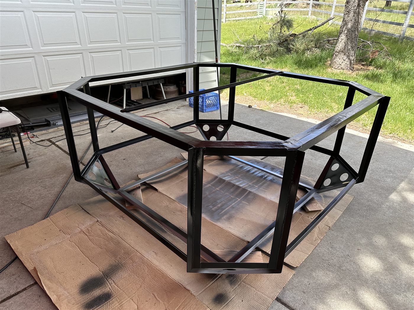 The trailer-mounted arena frame after receiving its protective black finish